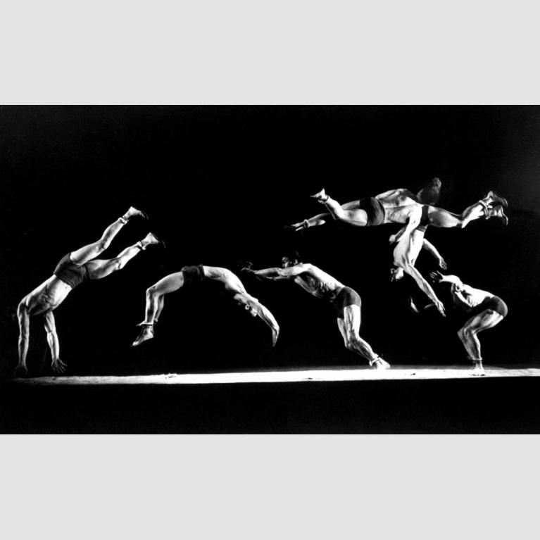 The repeated image of gymnast Newt Loken performing gymnastic moves.